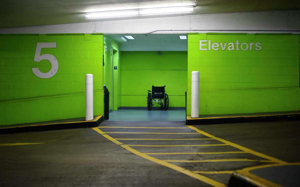 A wheel chair is abandoned outside a parking garage elevator at the Texas Medical Center.