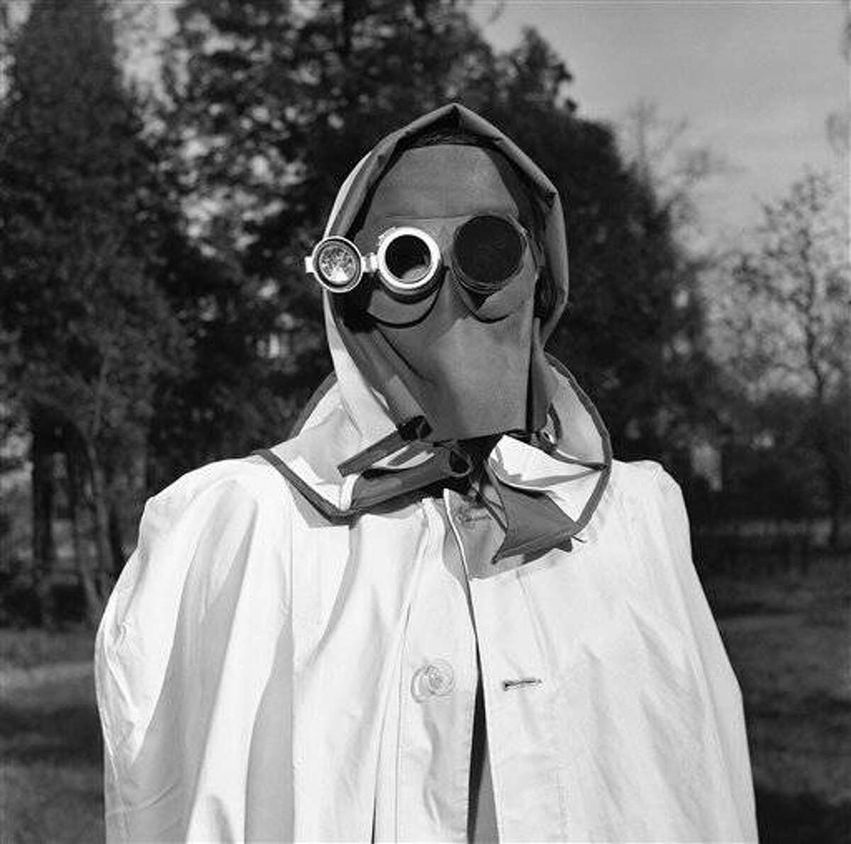 The face mask is recommended by a West German federal civil defense study group as protection against radioactive fallout in Hamburg, Germany, April 24, 1957. The dark glass at right protects the eye from intense light while the mirror, left, enables the wearer to read inside instruments indicating the intensity of radioactivity. (AP Photo/Henry Brueggemann)