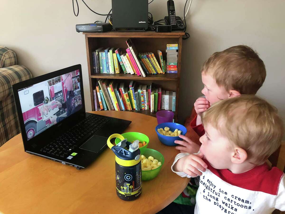 Nathaniel and Charles Dey of Wilton, Conn. watch Firefighter Story Time from their home in a previous year. One of the library’s upcoming virtual happenings is Firefighter Story Time Live, Feb. 23, from 10 to 10:30 a.m. via Zoom. Registration for this program is required at wiltonlibrary.org/events. For questions, email the library's Children's Library Manager Andrea Szabo at aszabo@wiltonlibrary.org.