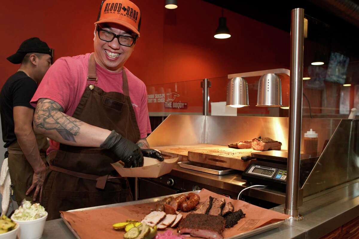 Quy Hoang prepares a platter of meats at Blood Bros. BBQ, 5425 Bellaire Blvd., Thursday, March 21, 2019, in Bellaire.