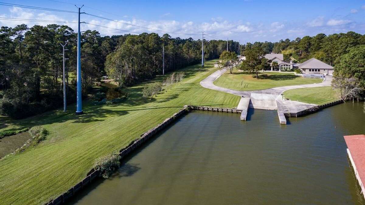 5M waterfront Lake Houston home offers its own private boat harbor