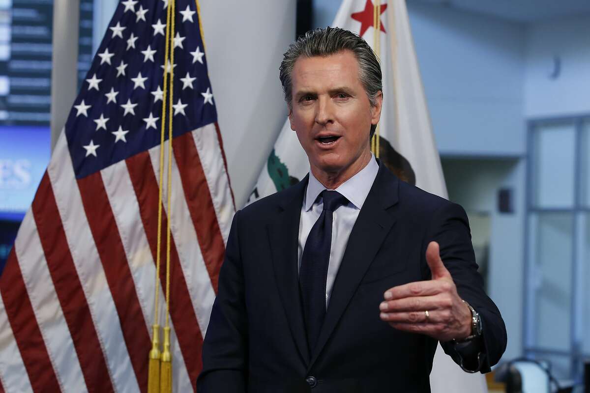 Gov. Gavin Newsom discusses an outline for what it will take to lift coronavirus restrictions during a news conference at the Governor's Office of Emergency Services in Rancho Cordova, Calif., Tuesday, April 14, 2020. Newsom said he won't loosen the state's mandatory stay-at-home order until hospitalizations, particularly those in intensive care units, "flatten and start to decline." (AP Photo/Rich Pedroncelli, Pool)