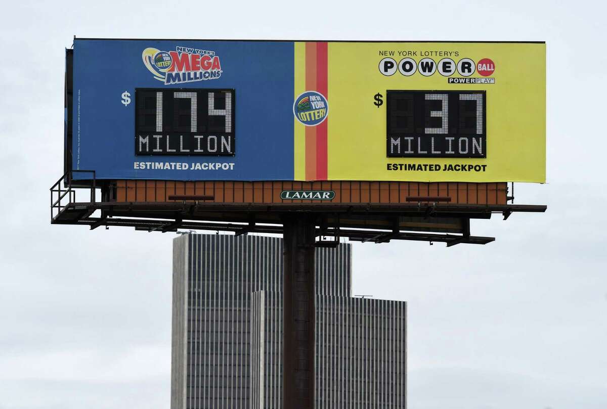 A lottery billboard shows the latest Mega Millions and Powerball jackpots on Friday, April 24, 2020, in Albany, N.Y. With stimulus checks being sent out, anti-gaming activists fear that a significant number of New Yorkers will squander their money and they are calling for a 30-day halt to the lottery. (Will Waldron/Times Union)