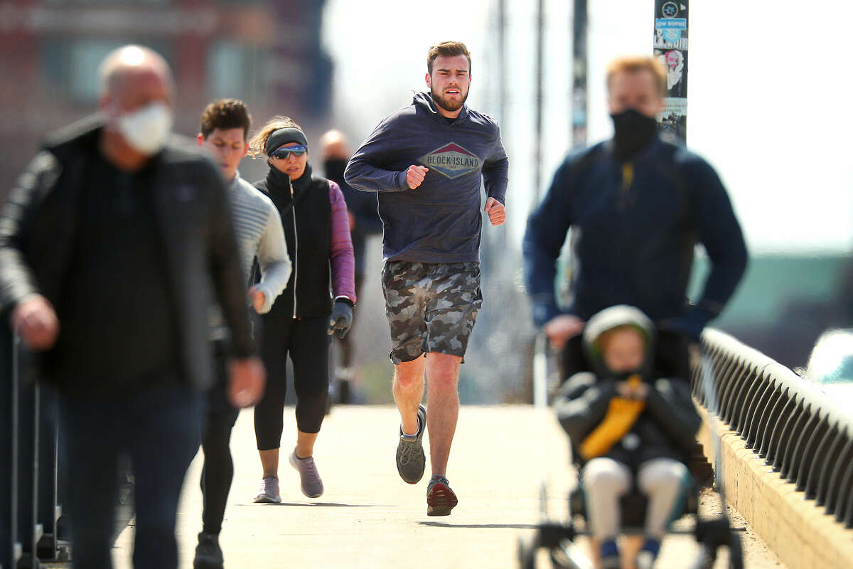 While runners are faced with whether to wear a mask, those individuals who they pass by have another question: Does someone who is jogging and infected with COVID-19 shed more virus and spew mucous particles farther than six feet?