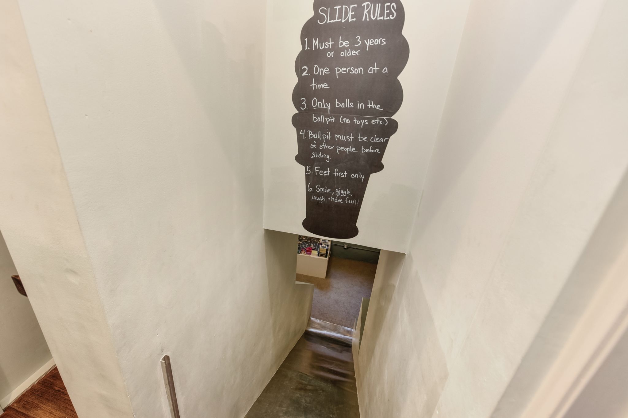 The home's most unique - and kid-friendly - feature is a slide that runs from the top floor to the basement that the current owners use as a family room. Stairs to the lower level run along the side of the slide to provide additional access.