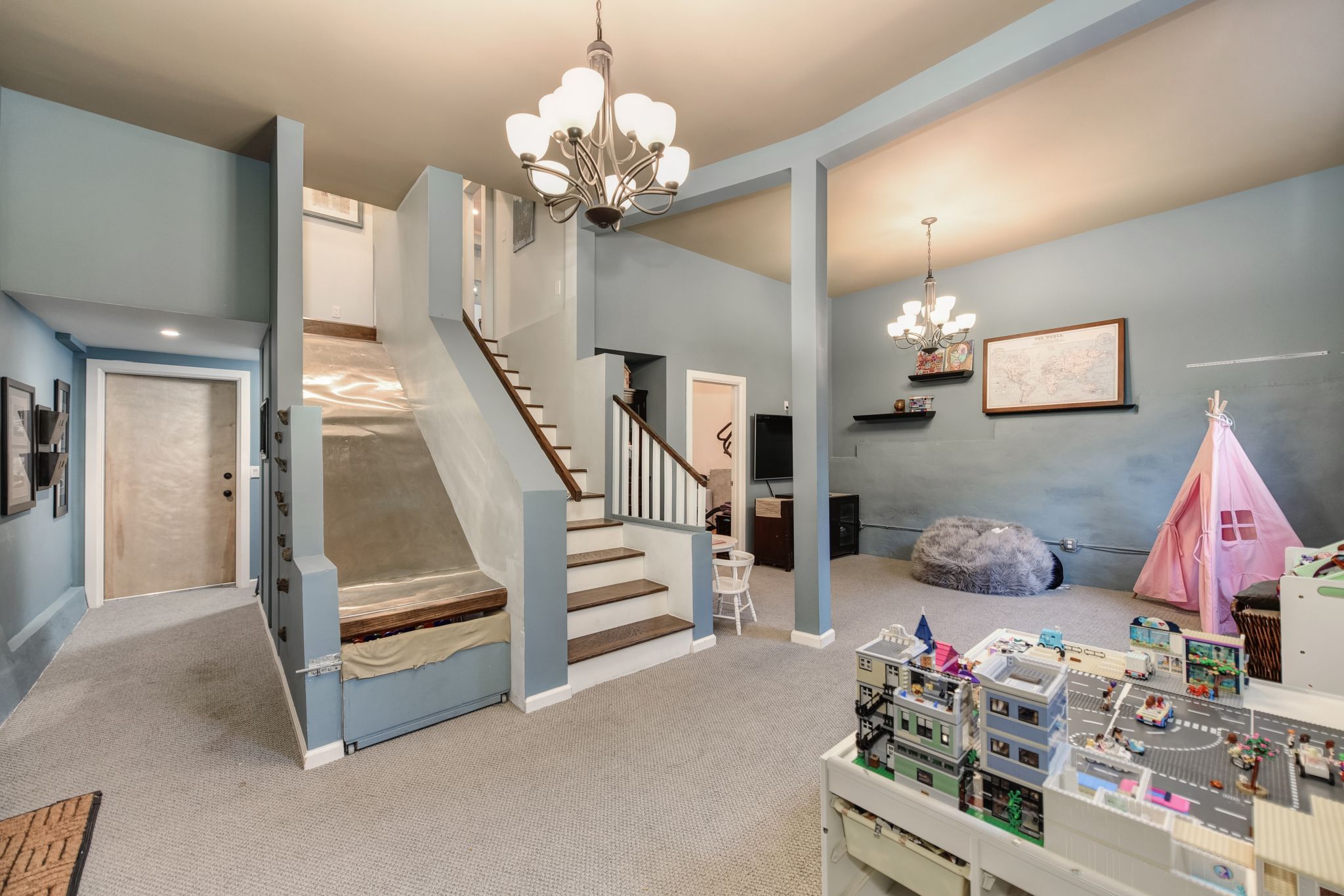 The lower level has 11-foot ceilings and is a perfect space for a play room or media room.