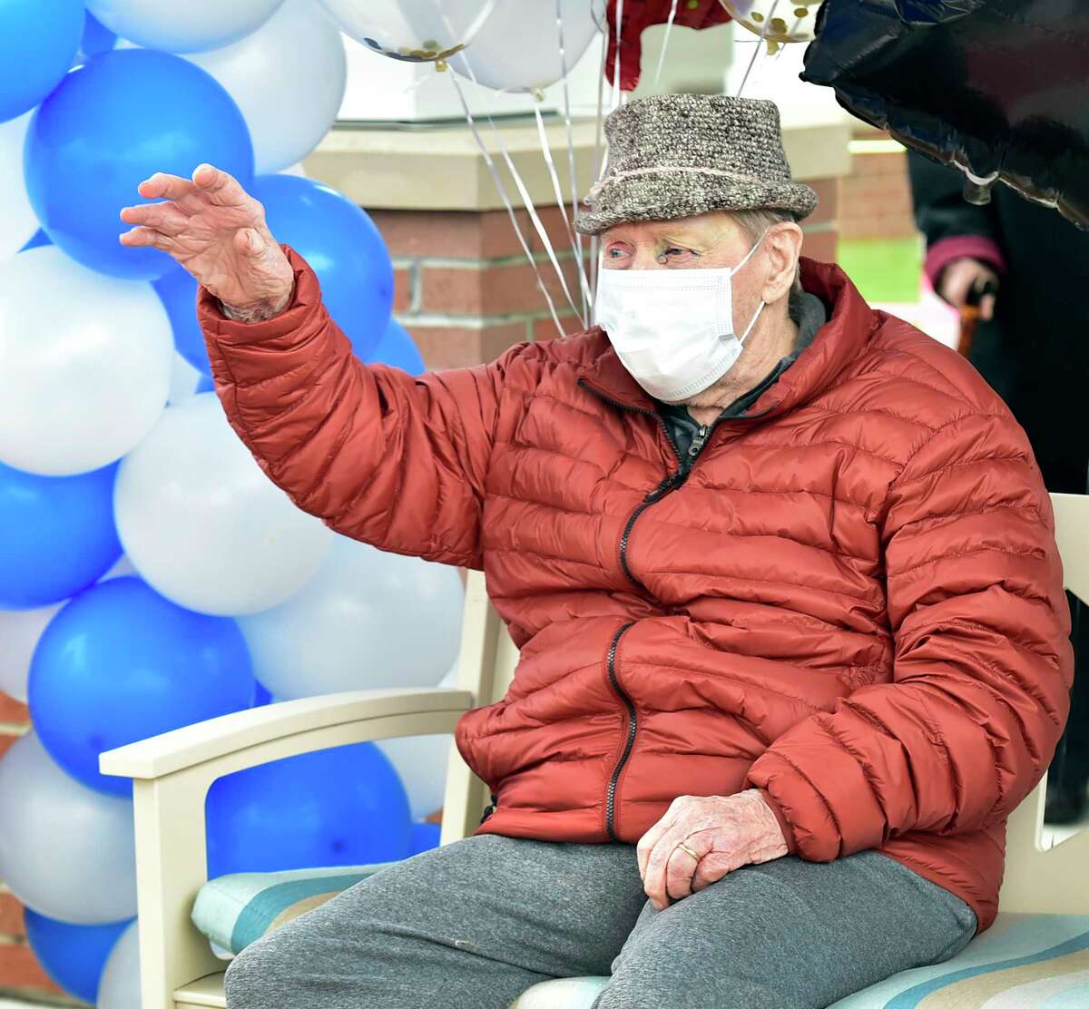 North Haven, Connecticut - Friday, April 24, 2020: Edward Otremba Sr., a resident at The Landing of North Haven assisted living facility, gets a birthday celebration at 100-years-old Friday using social distancing with a community car parade that included a North Haven Fire Department truck, the presentation of a birthday cake, and birthday songs in English and Polish. Ed's family was planning on a huge celebration at the community with friends and family but it had to canceled because of the Coronavirus / Covid-19 pandemic