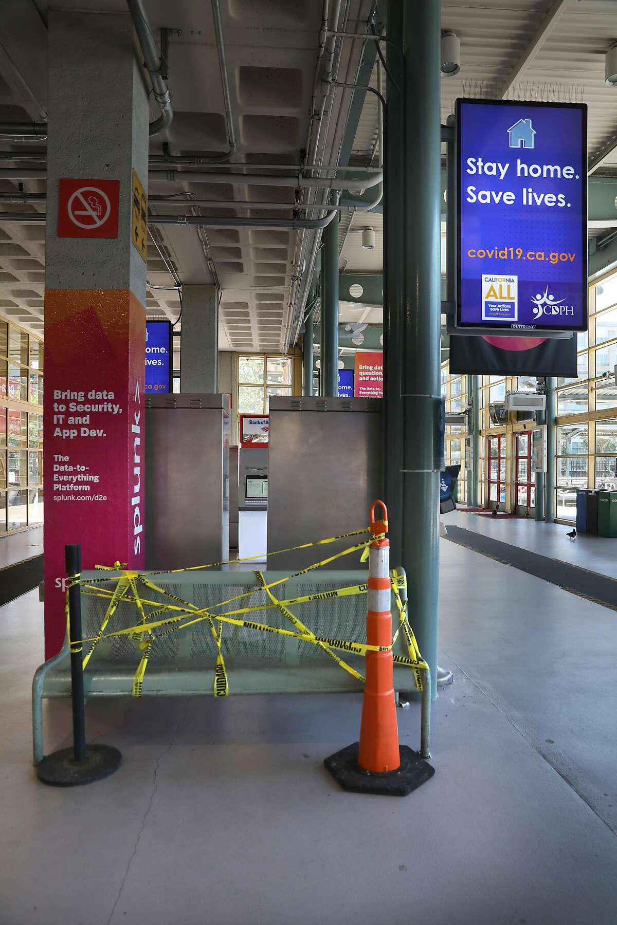Public bench cordoned off seen at Caltrain Station at 4th and King Streets on Thursday, April 23, 2020, in San Francisco, Calif.