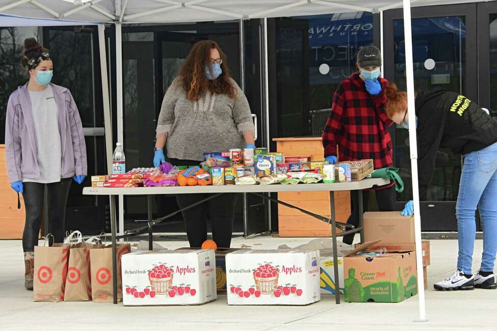 Members of the community drop off donations as Northway Church Partners with Veterans Community and Housing Coalition to Feed Homeless Veterans on Friday, April 24, 2020 in Clifton Park, N.Y. Donations will go directly to the Vet House which provides beds to homeless veterans as well as distributed to vets and families in permanent supportive housing. (Lori Van Buren/Times Union)