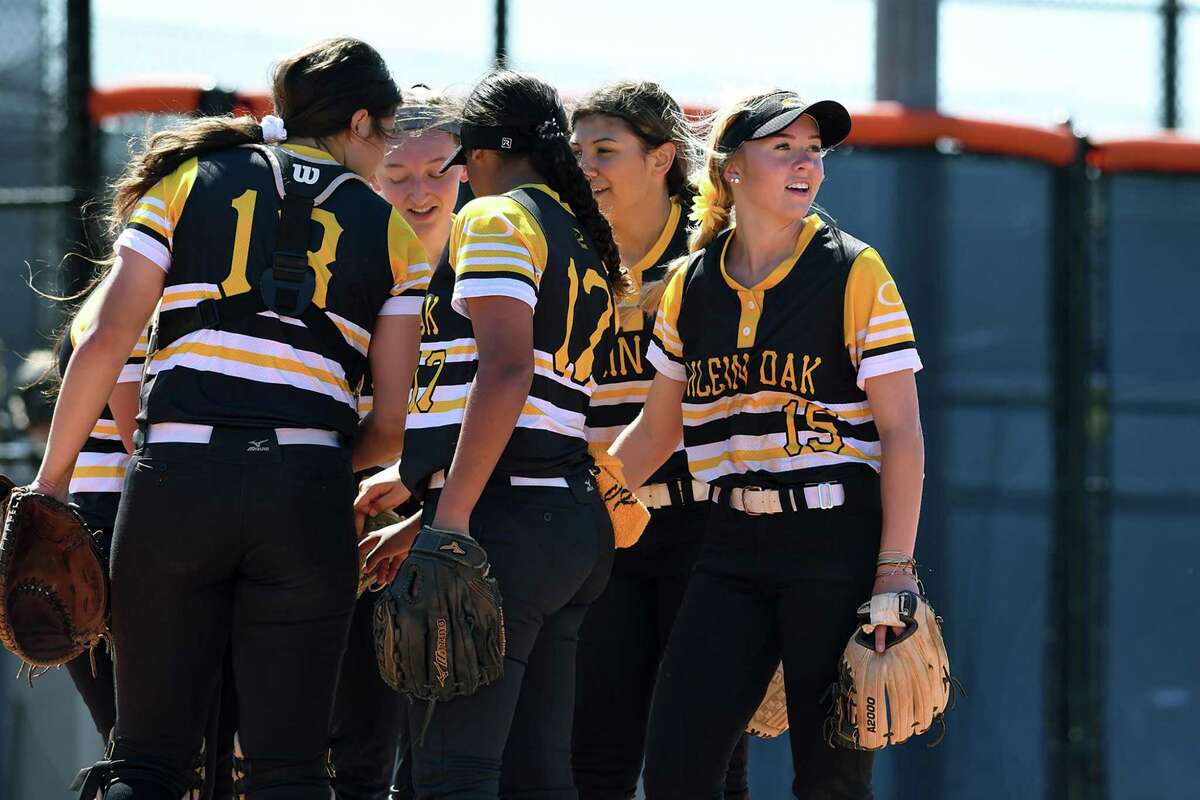Klein Oak junior second baseman Allie Saville, right, is all smiles as she and her teammates get ready to play defense against Bridgeland during their bracket game at Bridgeland High School during the Cy-Fair Softball Tournament on March 5, 2020.