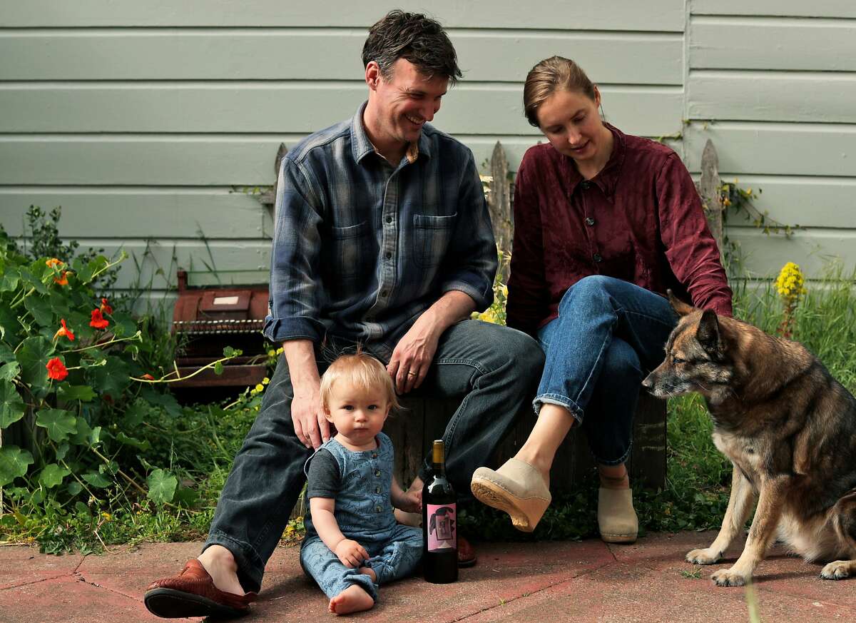 Charlie Miller and Emma Rosenbush with their son Frank, 13 mos, and dog Dewey in the yard of their home in San Francisco, Calif., on Wednesday, April 22, 2020. Charlie and Emma created Dewey’s Wines named after Dewey, and produce four wines.