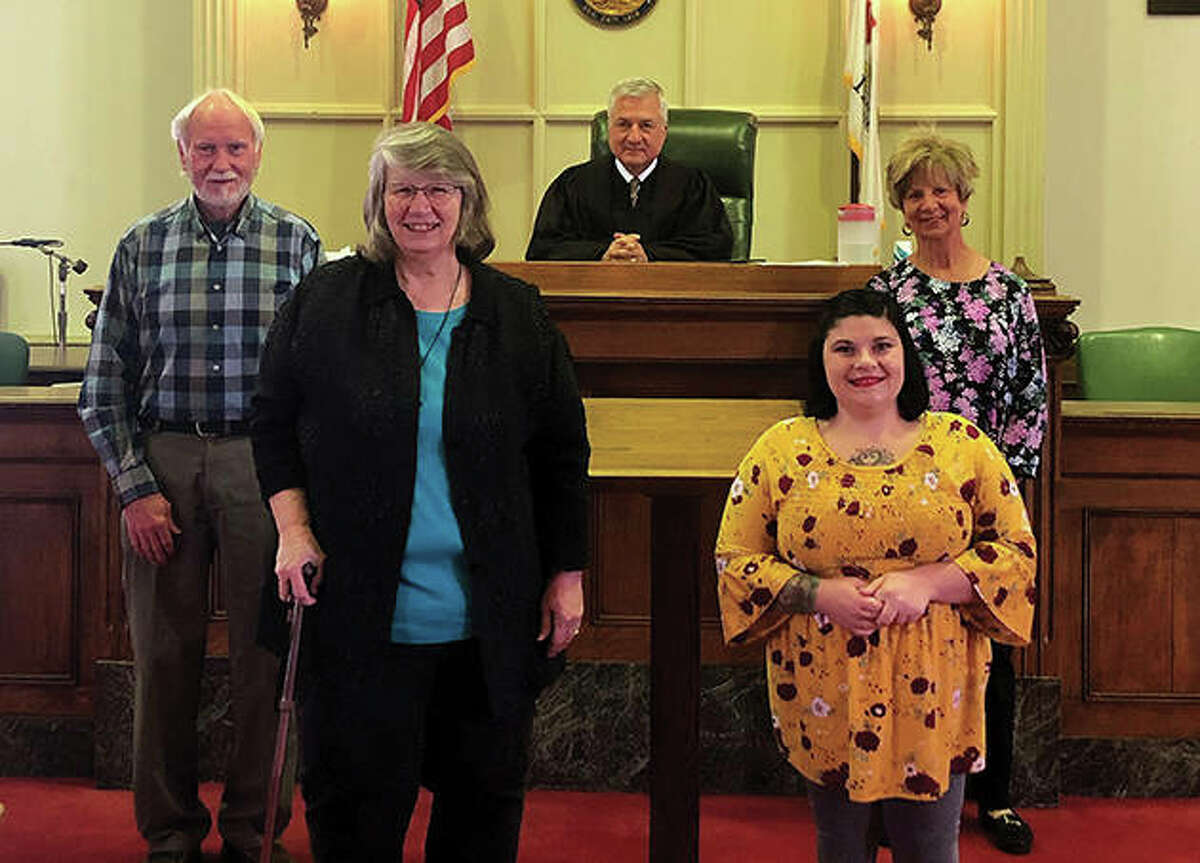 The newest Morgan County Court Appointed Special Advocates are Gary Morris (from left), Tonda Stouffe, Nikki McPherson and Susan Hall. They were sworn in by Judge Jeffery Tobin (center).