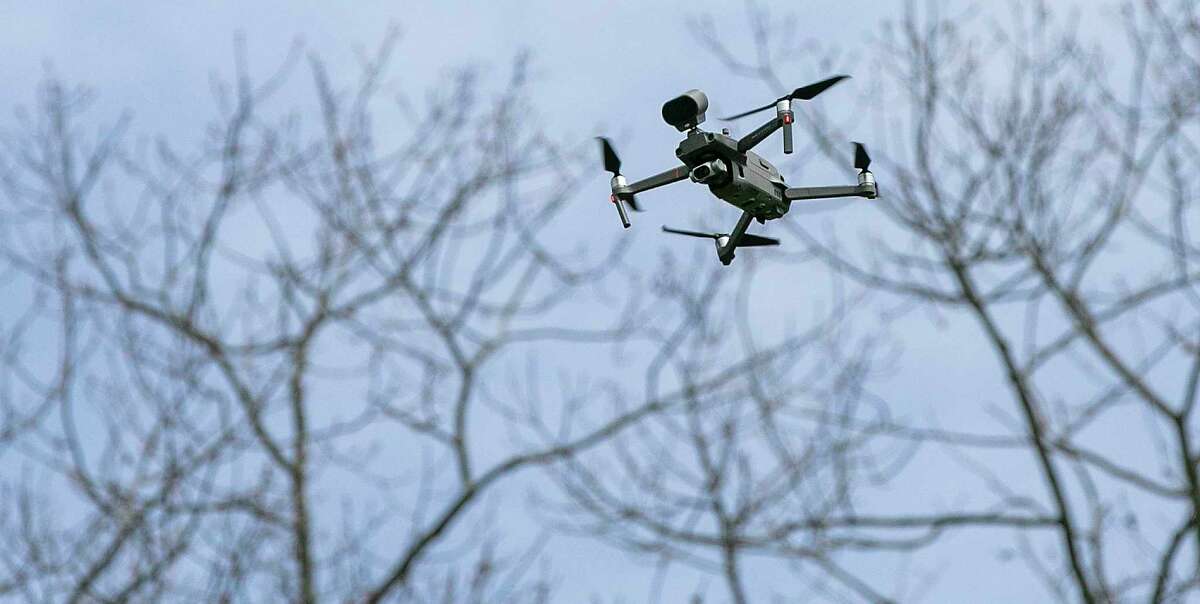 In this photo a drone, which has a speaker attached, is being used in Meriden, Conn. to remind visitors to practice social distancing and limit their gatherings in public settings during the coronavirus pandemic. (AP Photo)