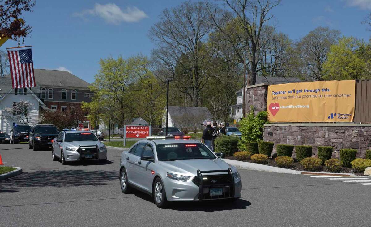 First responders paraded past the entrance to New Milford Hospital to thank them for their work on the front lines fighting the coronavirus on April 28 in New Milford.