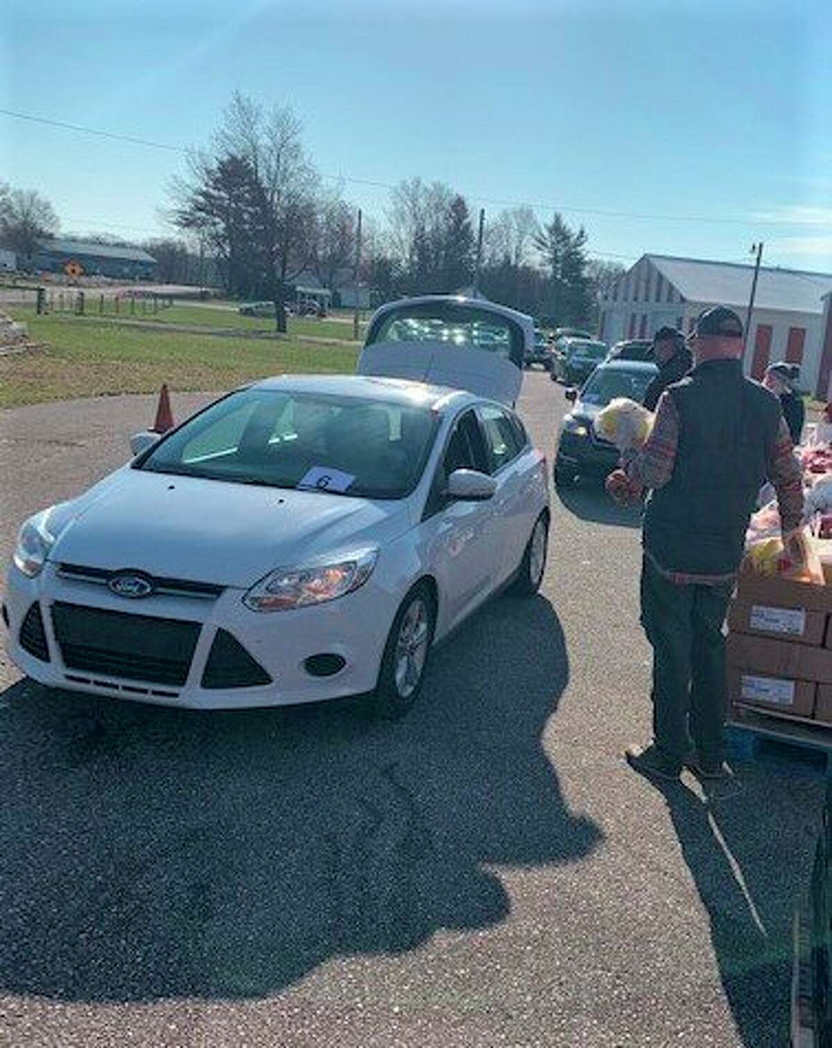 Volunteers hand out food during a previous Greater Big Rapids Area Mobile Food Pantry event. To practice safe social distancing, residents were asked to remain in their vehicles during their visit. The next distribution is at 10 a.m. Saturday, Jan. 22. (Courtesy photo)