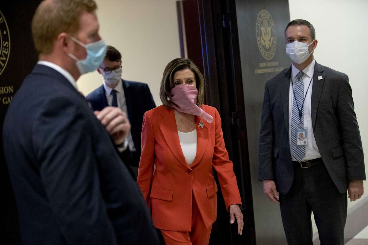 House Speaker Nancy Pelosi of Calif., departs a news conference on Capitol Hill, Friday, April 24, 2020, in Washington. (AP Photo/Andrew Harnik)