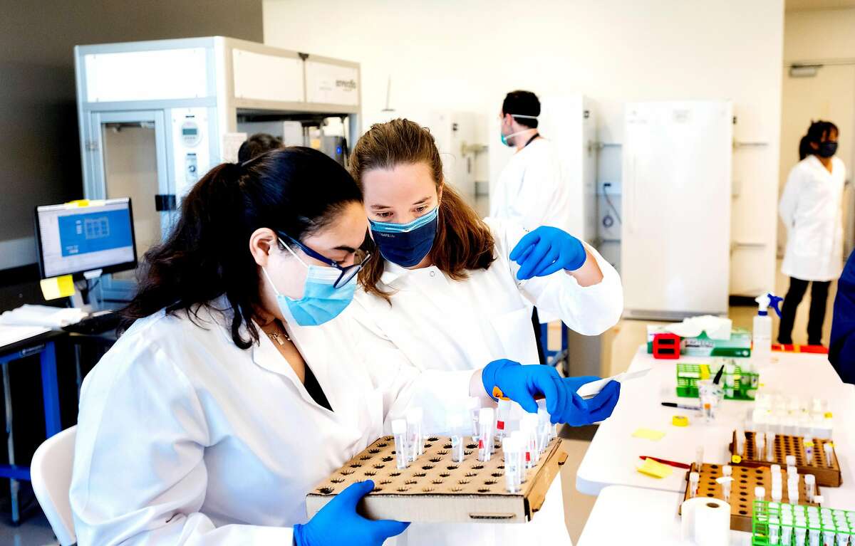 UCSF scientists Valentina Garcia, right, and Paula Serpa process COVID-19 test samples at a new UCSF diagnostic laboratory adjacent to the Chan Zuckerberg Biohub (CZ Biohub) on Friday, April 24, 2020, in San Francisco. (Photo by Noah Berger)