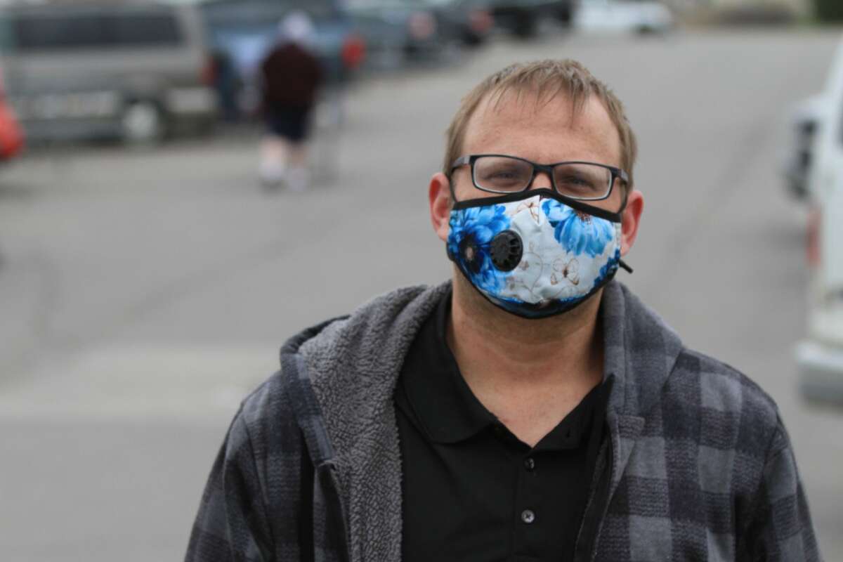 Mandated masks in public spaces have changed the look and feel of everyday life. Damon Essenmacker was adding a bit of color to the world by sporting a floral print mask.