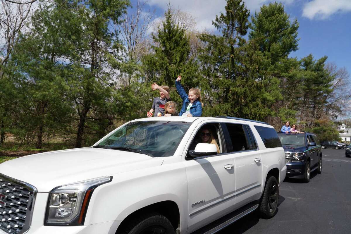 Children at the First Presbyterian Nursery School just had to get a peek at their teachers during a drive-by event held at the school recently. The car is being driven by Parent and Board Member Erin Marich. The children in the sunroof are Ben, Lucy and Hadley Marich.