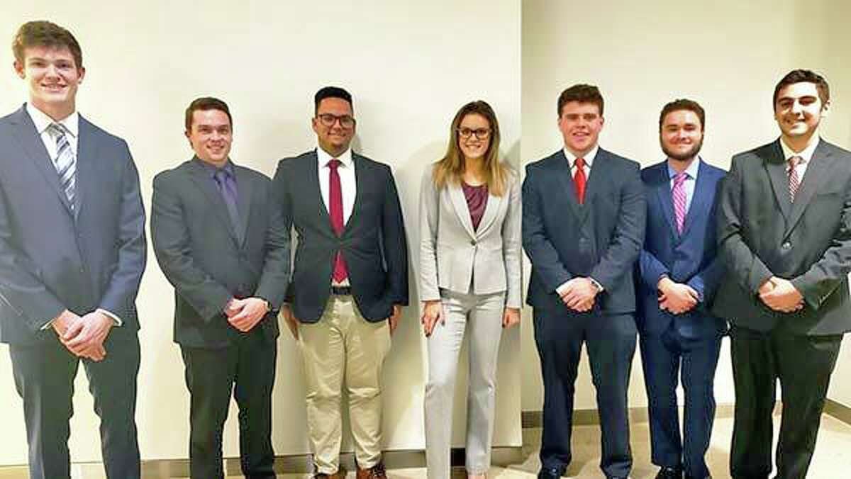 Middletown resident and Bryant University student Courtney Vogel, at center, was a finalist in an Introduction to Information Technology and Analytics course competition.