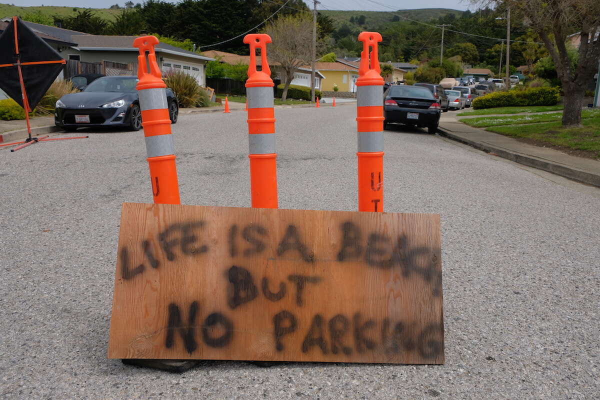 San Mateo County's beaches are open, but their parking lots are not due to the coronavirus pandemic. That's caused people to search for parking on residential streets like this one in the Linda Mar neighborhood of Pacifica. In response, the residents have erected their own makeshift no-parking signs. (April 26, 2020,)