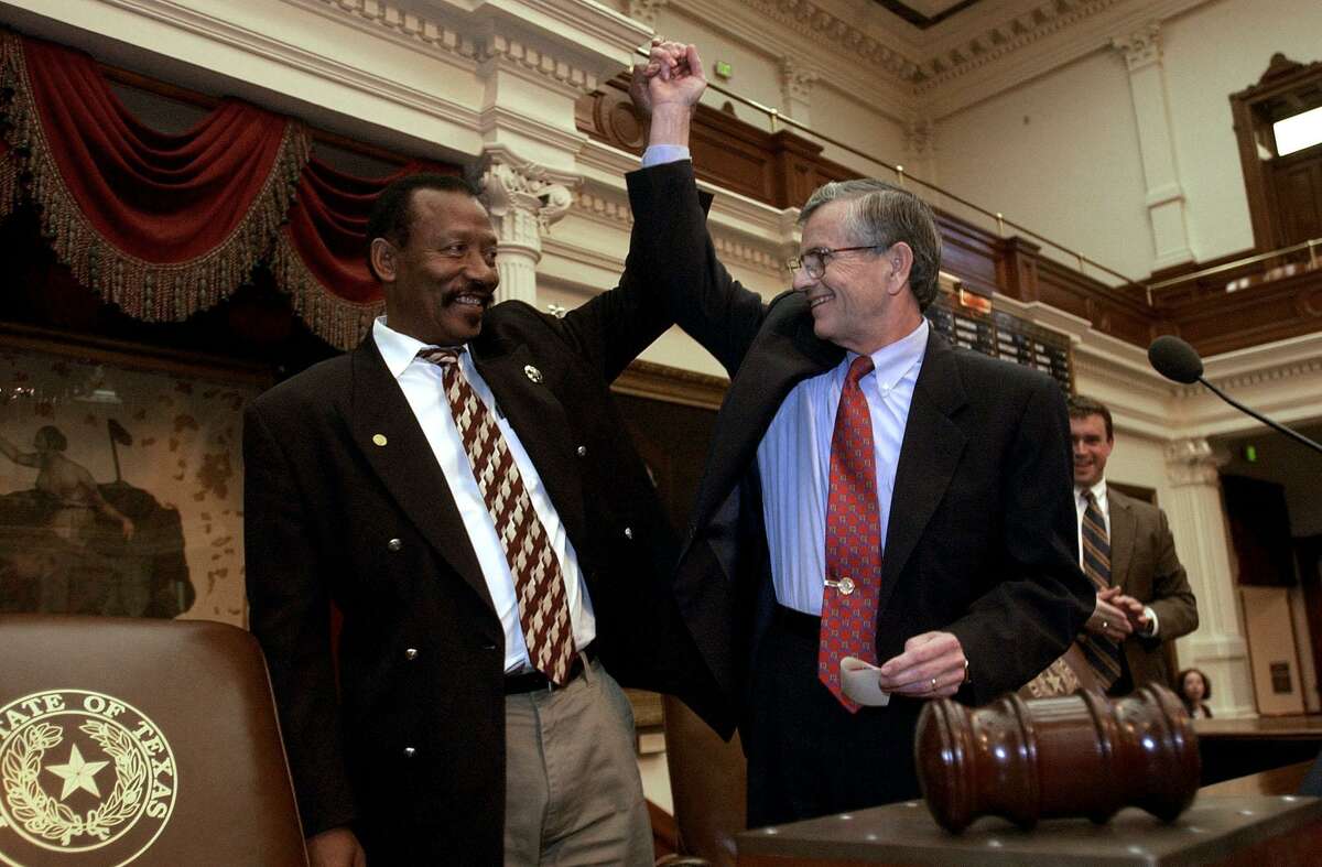 Rep. Al Edwards, D-Houston, raises the arm of House Speaker Tom Craddick in victory after the close the 2003 session of the Texas House at the Capitol in Austin, Texas, Monday, June 2, 2003. CHRISTOBAL PEREZ/HOUSTON CHRONICLE. HOUCHRON CAPTION