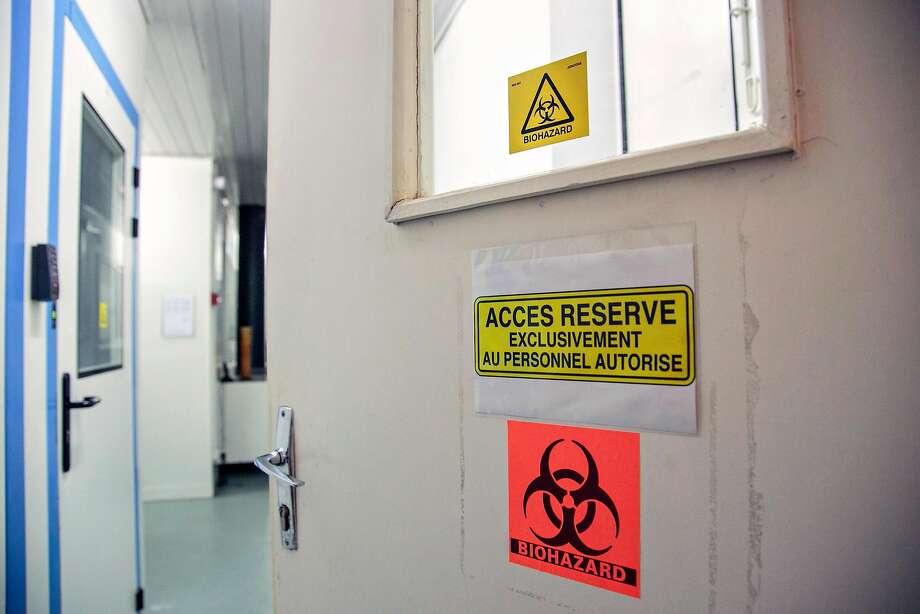 Entrance to a highly secure room at the Pasteur Institute where the world's deadliest viruses of recent years are stored and which are used for vaccine research. Since mid-March, Institut Pasteur, which has partnered with UCSF and Mount Sinai in a major coronavirus research effort, has tested 2,300 patients for COVID-19. Each test requires four hours to process. Photo: Rijasolo / AFP / Getty Images