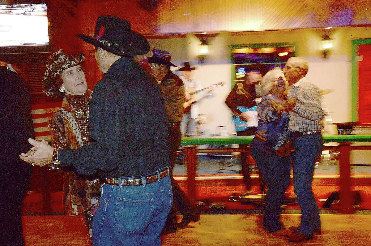 Couples dance to the classic country music of Godwin and Co. Thursday night at Mackenzie's Pub in Beaumont. Godwin's classical country - western tunes are popular with older dancers, who find modern, pop takes on the genre out of step with traditional dancing. Photo taken Thursday, January 11, 2018 Kim Brent/The Enterprise