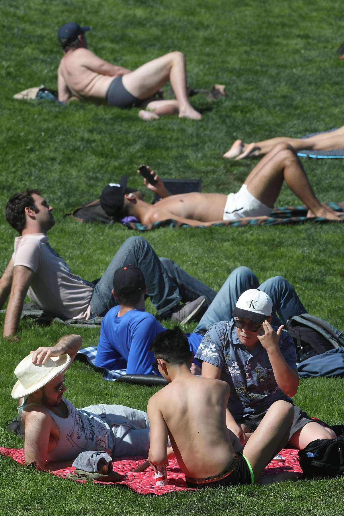 Sunbathers seen at Dolores park today on Tuesday, April 14, 2020, in San Francisco, Calif.
