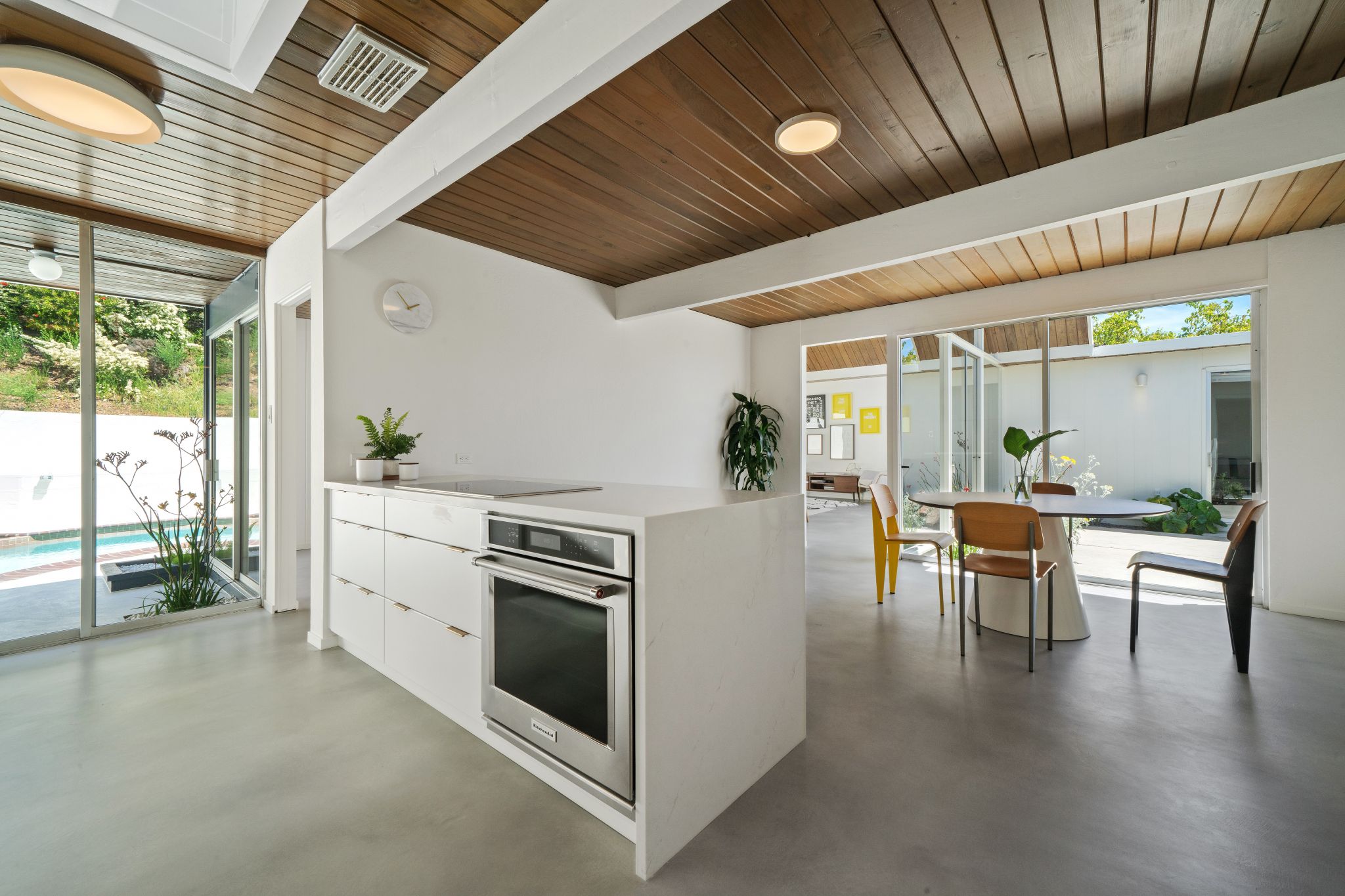 Unlike many 1960s homes, the kitchen here is totally open, flowing from one room to the next and from inside to outside.