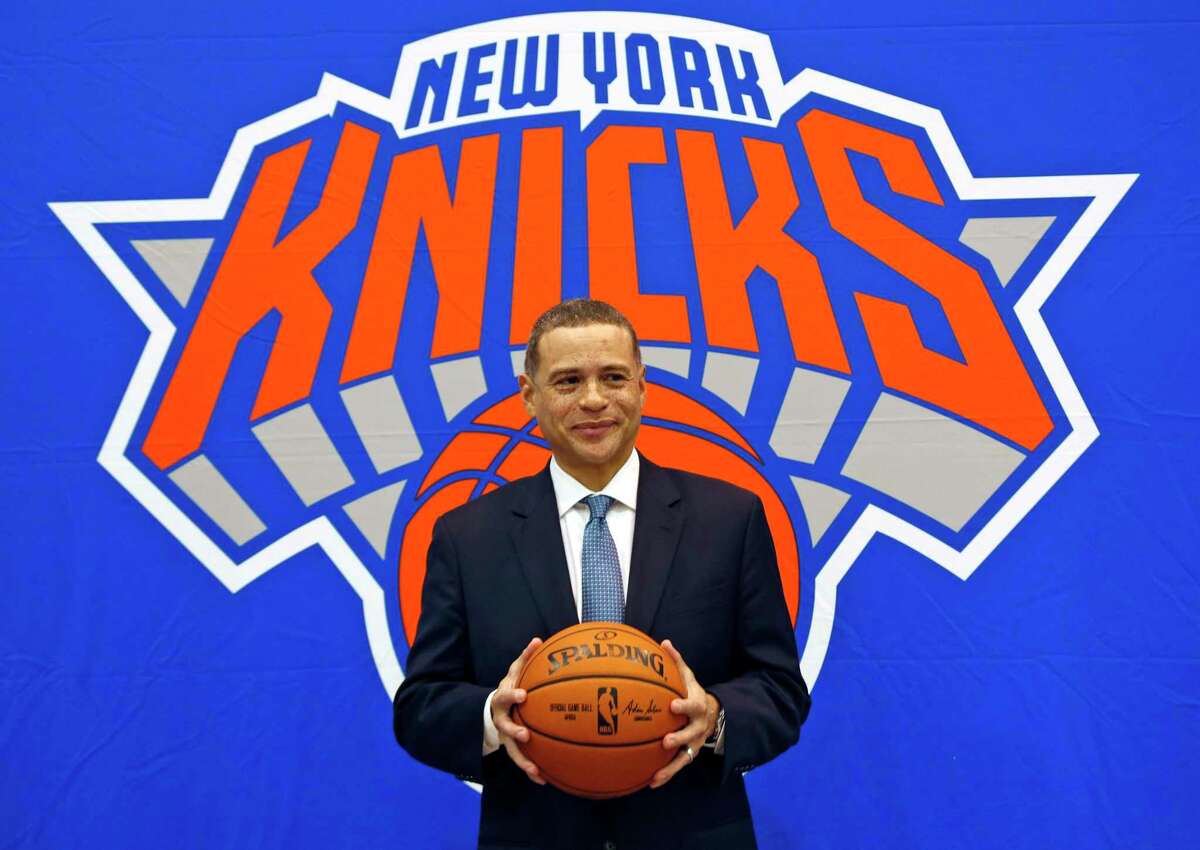 FILE - In this July 17, 2017, file photo, New York Knicks general manager Scott Perry poses for a picture after a news conference in Greenburgh, N.Y. Scott Perry will remain general manager of the New York Knicks after agreeing to a new one-year deal with the team Wednesday, April 29, 2020. (AP Photo/Seth Wenig, File)