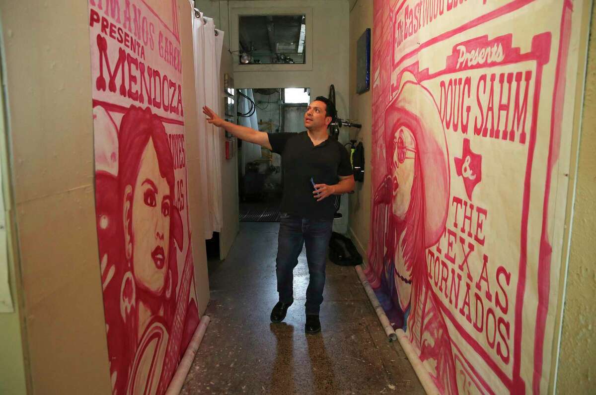 Artist David Blancas is working in his studio to restore “La Musica de San Anto,” a mural he painted 10 years ago that is showing some wear.