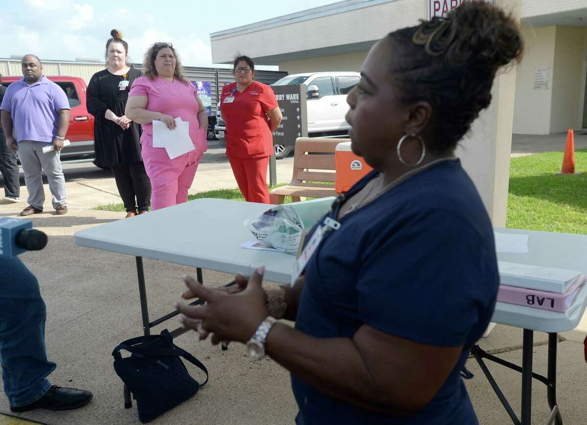 Nurse LaTasha Mayon describes the procedure for testing that will take place at the drive-thru testing unit for COVID-19 at Jack Brooks Regional Airport Monday, which will open Tuesday morning. They expect to test roughly 25 people per day and already have a full testing schedule for their opening day. The testing center will service residents throughout several Southeast Texas counties. Photo taken Monday, March 23, 2020 Kim Brent/The Enterprise