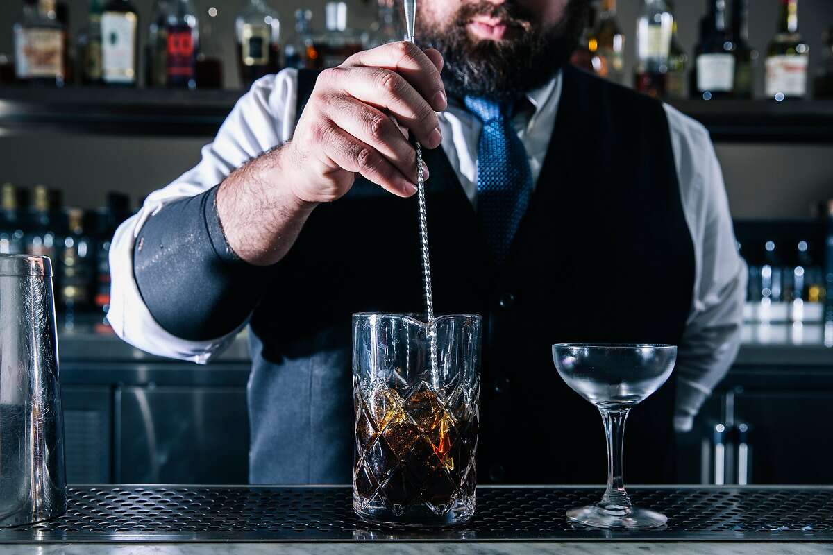 Ronnie Arevalo, lead bartender at Commis' CDP Bar, mixes a Medianoche cocktail in Oakland, Calif. on Wednesday, March 4, 2020.