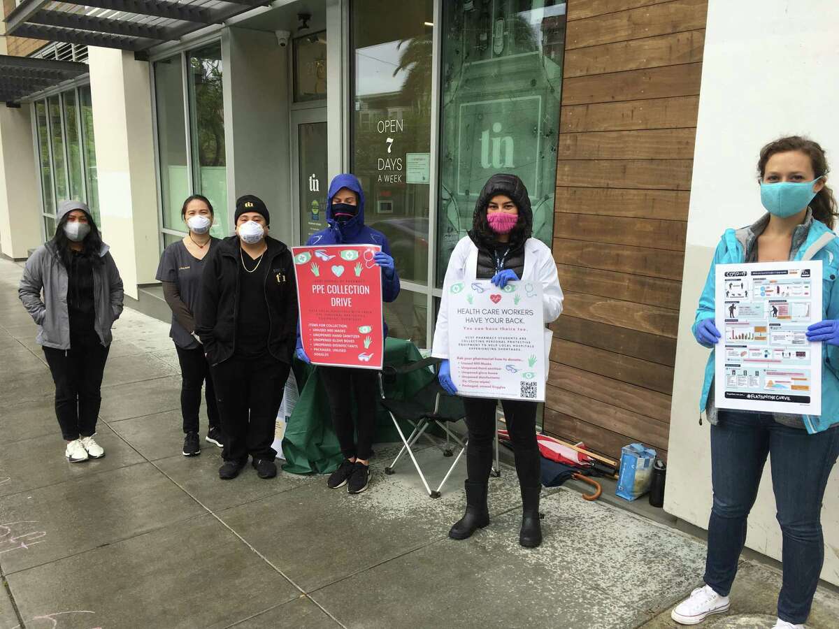 UCSF pharmacy students (from right) Adriana Gardner, Leena Dolle and Marianne Duran help organize a personal protective equipment donation drive at the TIN Rx pharmacy in San Francisco.