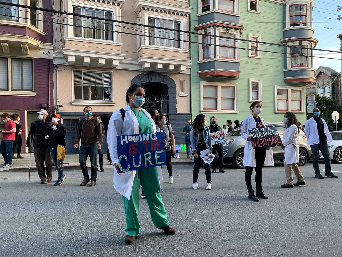 A group of protestors gathered in front of San Francisco Mayor London Breed's house on Thursday, Apri 30, 2020 alleging San Francisco has failed to meet deadline for leasing enough hotel rooms to house the homeless during the coronavirus pandemic.