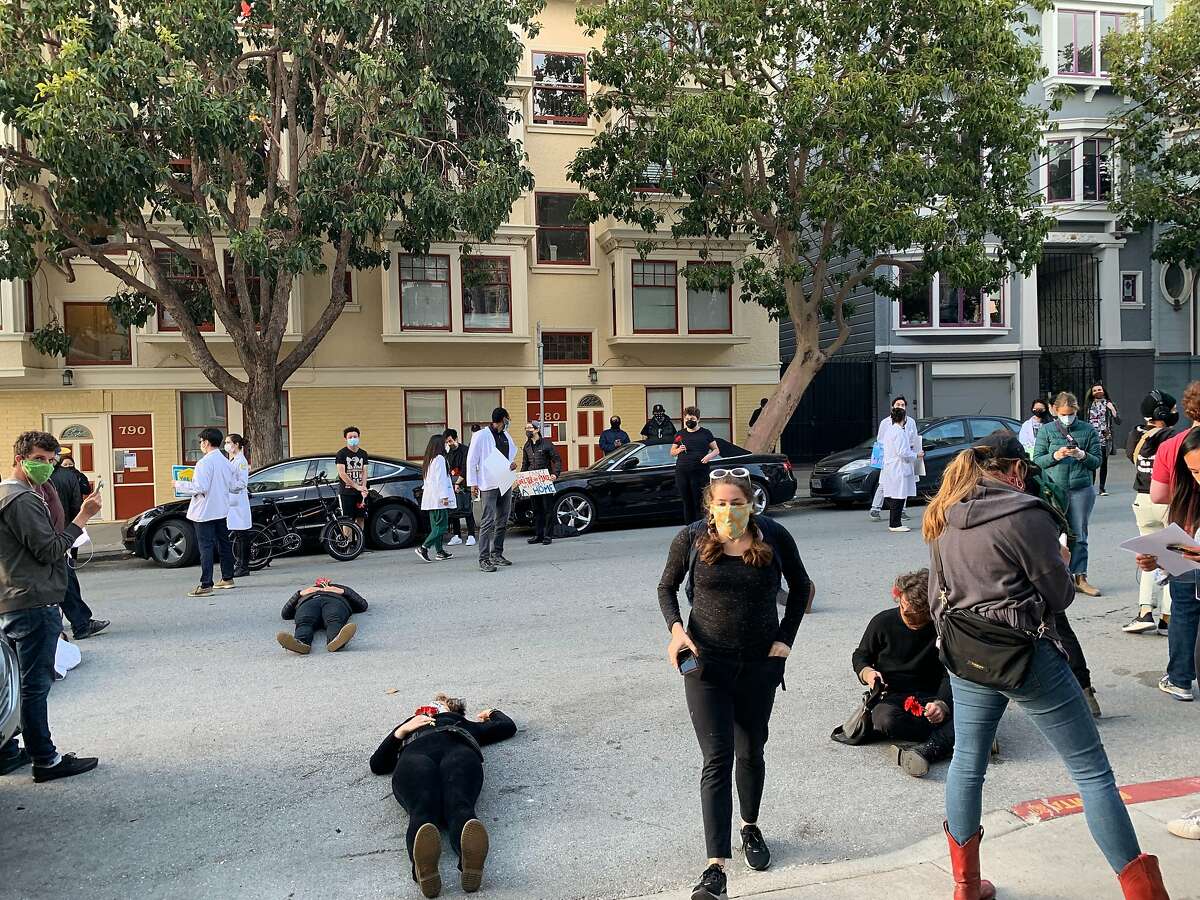 A group of protestors gathered in front of San Francisco Mayor London Breed's house on Thursday, Apri 30, 2020 alleging San Francisco has failed to meet deadline for leasing enough hotel rooms to house the homeless during the coronavirus pandemic.