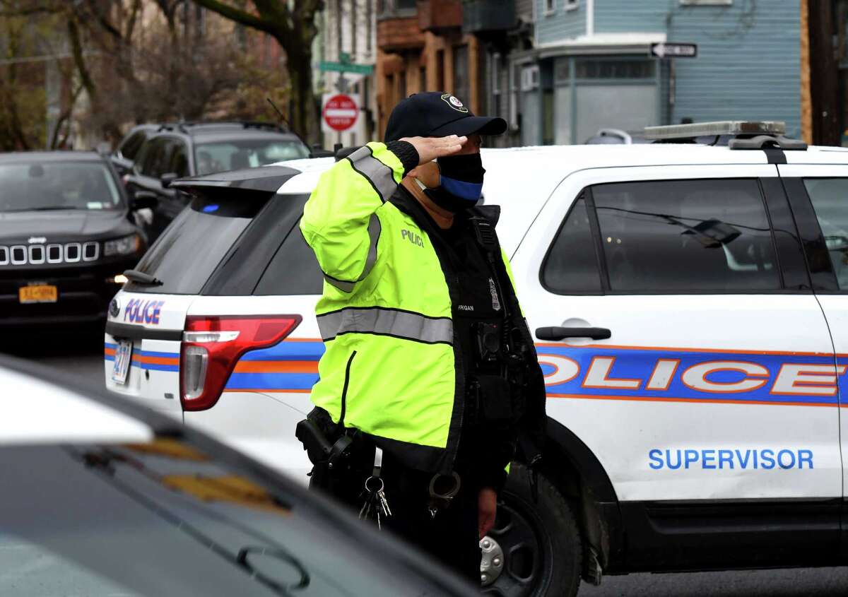 Police line Albany streets to salute officer who died of coronavirus