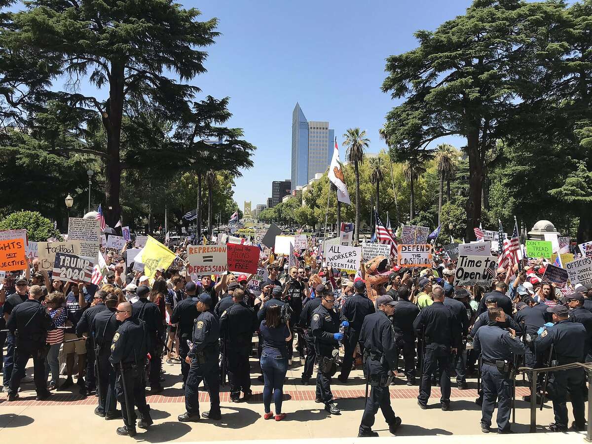 Protestors gathered at the state Capitol on Friday, May 1, 2020, to demand that Gov. Gavin Newsom reopen California, which is under a statewide stay-at-home order to slow the spread of the coronavirus.