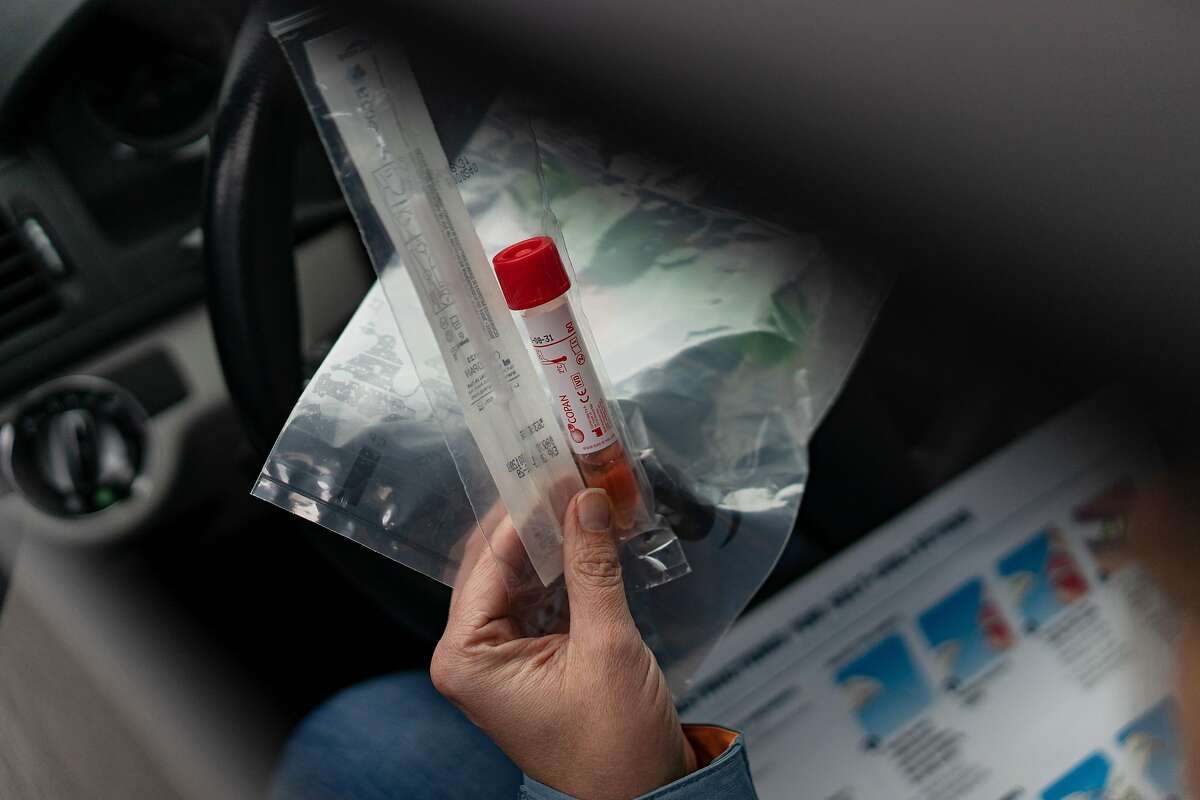 A detail of a COVID-19 single test swab packet administered at a Walmart pharmacy testing site.