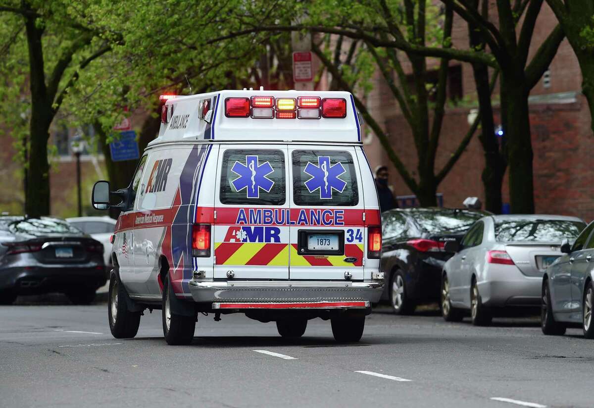 An AMR ambulance heads to another call after leaving the emergency room at Yale New Haven Hospital in New Haven on May 1, 2020.