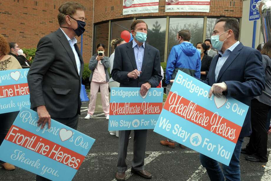 Gov. Ned Lamont, left, U.S. Sen Richard Blumenthal, center, and Mayor Joe Ganim speak together during a thank you rally in front of Northbridge Health Care Center in Bridgeport May 1, 2020. State and local rules on reopening Connecticut are being formulated. Photo: Ned Gerard / Hearst Connecticut Media / Connecticut Post