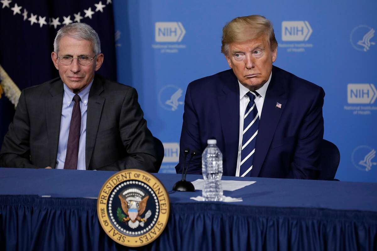 President Donald Trump, right, sits next to Anthony Fauci, director of the National Institute of Allergy and Infectious Diseases, during a coronavirus roundtable briefing on March 3, 2020, in Bethesda, Md. (Yuri Gripas/Abaca Press/TNS)
