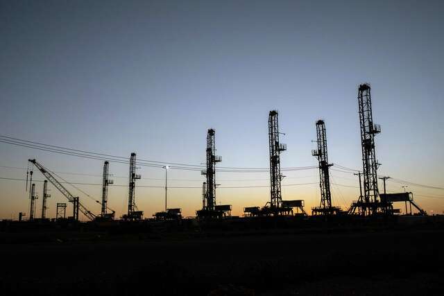 Unused oil drilling rigs are stored in Odessa, Texas, on April 24, 2020.