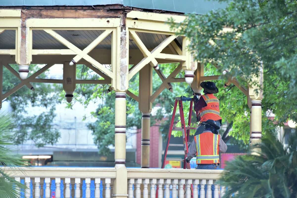 Workers disassemble the 1970's bandstand in Alamo Plaza Friday morning. The bandstand is being moved to the Becky V. and Vincent M. Dawson Park at 803 Cherry St.