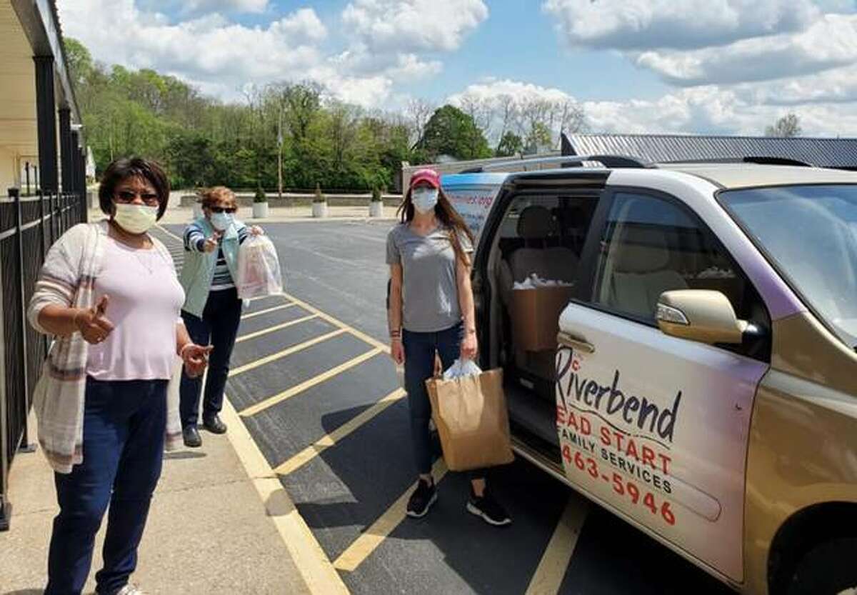 SSP helps prepare provide meals and supplies to area families in need, with Riverbend Head Start staff loading vans and delivering the items.