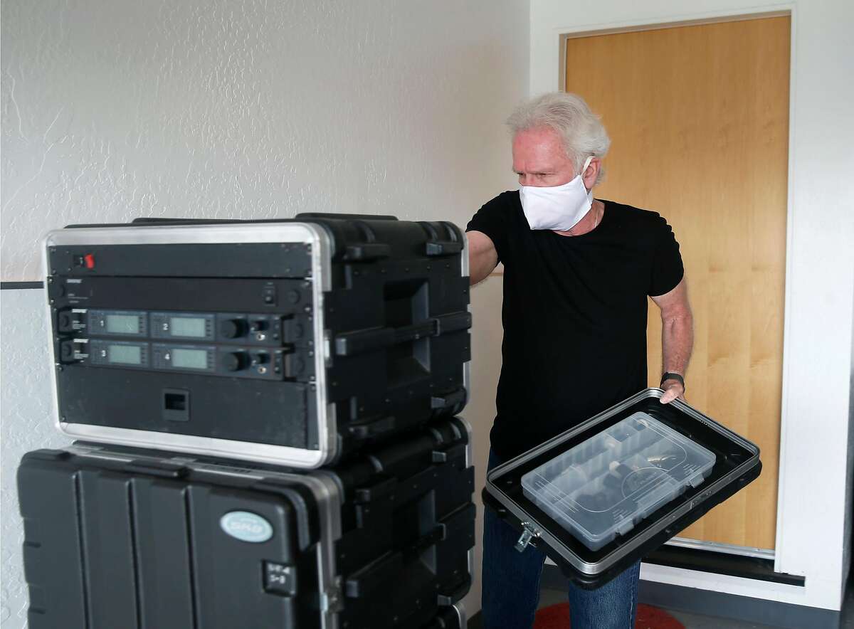 Audio engineer Alfred Tetzner calibrates recording equipment stored in his garage while he shelters in place during the coronavirus pandemic in Pacifica, Calif. on Saturday, May 2, 2020.