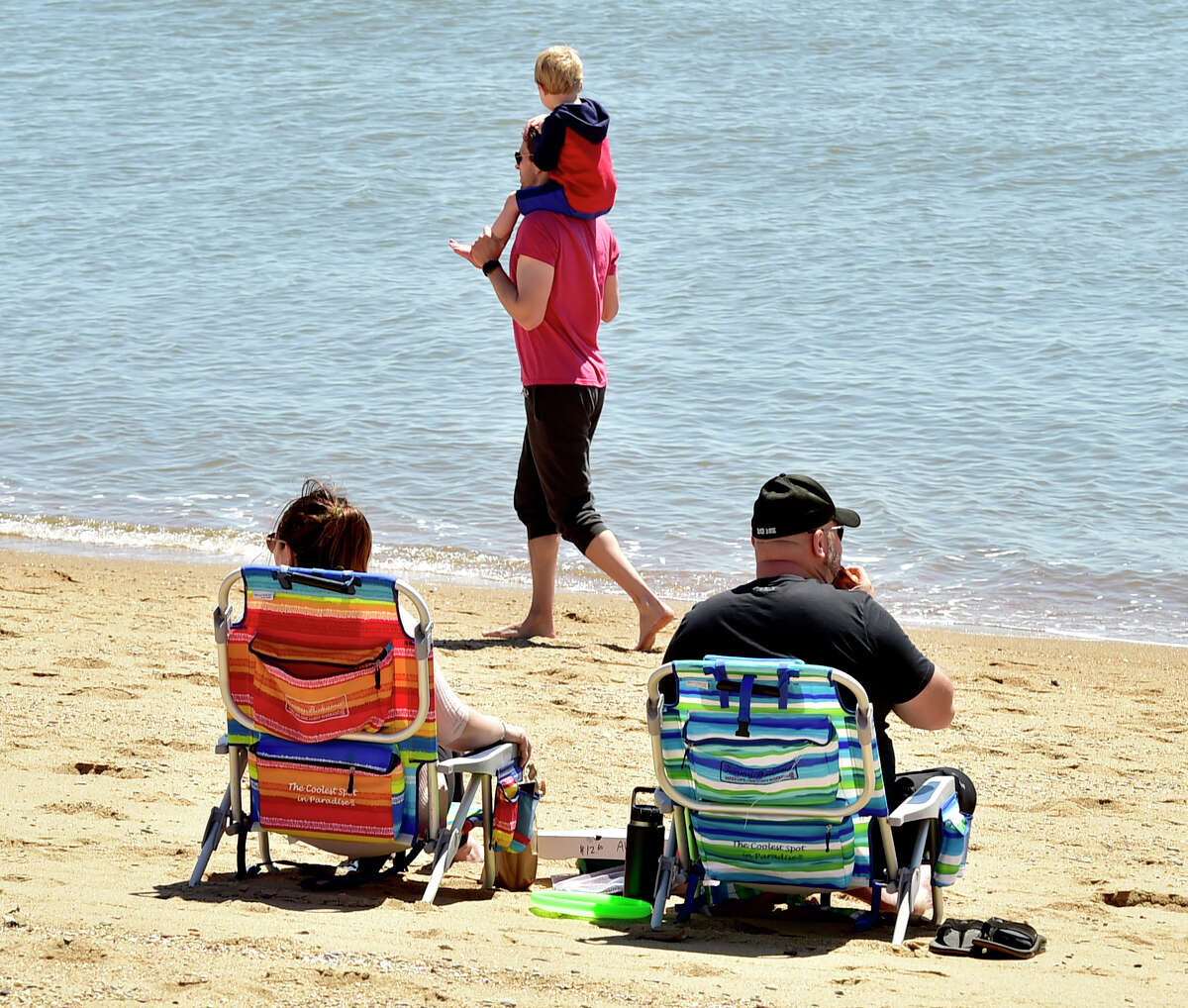 Madison, Connecticut, Saturday, May 1, 2020: People enjoy the warmth and sunshine Saturday at the Surf Club town beach in Madison during the Covid-19 / Coronavirus pandemic.
