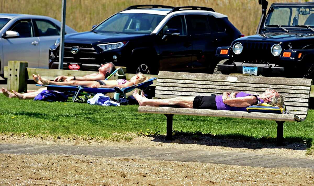 Guilford, Connecticut, Saturday, May 2, 2020: People enjoy the warmth and sunshine Saturday at Jacob's Beach in Guilford during the Coronavirus / Covid-19 pandemic.