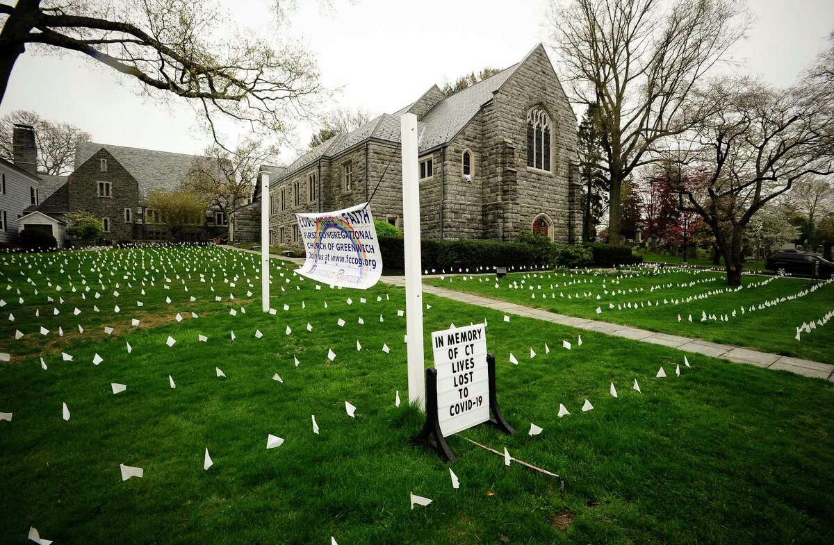 Thousands of white markers are placed on the lawn surrounding the First Congregational Church of Greenwich on April 29, 2020 to honor the many lives lost as result of the COVID-19 pandemic.